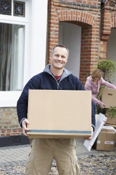 Removal van and moving boxes in a Hammersmith residential street
