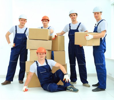 Loading furniture and boxes into a removals van in West London
