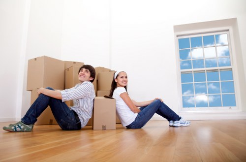 Unpacking boxes in a Hammersmith flat after moving day