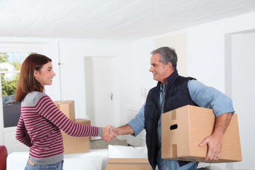Packed moving boxes and furniture ready for a home removal in Hammersmith