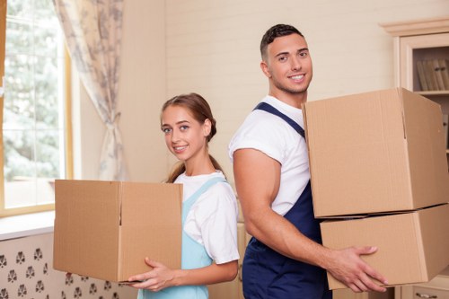 Furniture being carried for a flat move in Hammersmith
