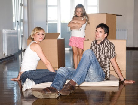 Packing and loading items into a moving truck in West London